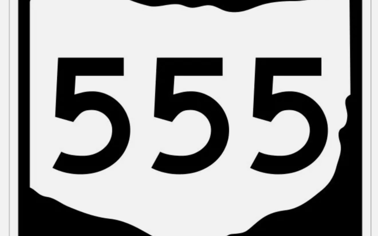 An illustration of the Ohio State Route 555 sign. It is a black background with a white shape of the state of Ohio with black numbers.